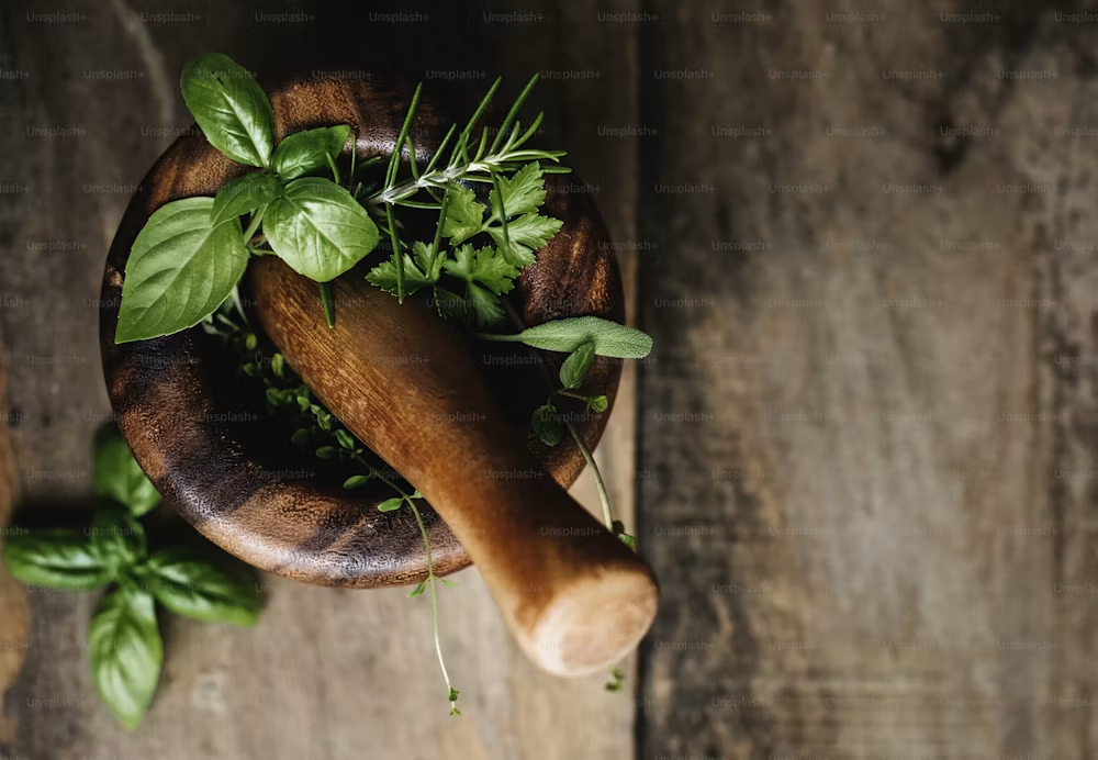 Fresh basil, mint, and rosemary on a cutting board